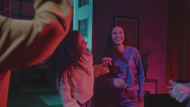 Gen z people dancing at home disco with smiling face
