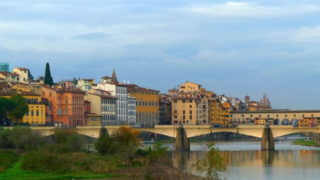 Ponte Vecchio (Old Bridge) is medieval stone closed-spandrel segmental arch bridge over Arno River, in Florence, Italy, noted for still having shops built along it.