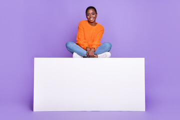 Full size photo of young cheerful girl sit platform wear casual clothes isolated over violet color background