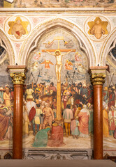 Large decorative wall fresco representing Jesus´ crucifixion inside gothic church in Italy - obrazy, fototapety, plakaty