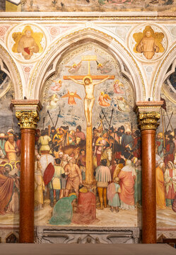 Large decorative wall fresco representing Jesus´ crucifixion inside gothic church in Italy