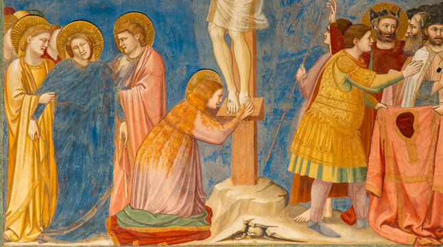Detail of colorful religious painting showing a long haired blond woman crying on Jesus´ feet on the cross