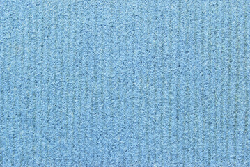 A sheet of porous, fibrous, and ribbed texture as background