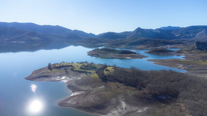 aerial view of the Porma reservoir in the province of León, Spain. With reflections of mountains in the water