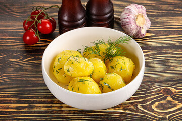 Boiled potato with oil and dill