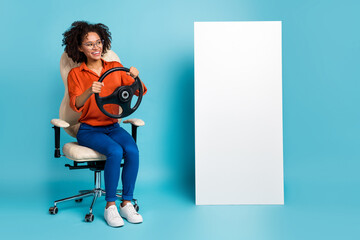 Photo of dreamy lady worker dressed orange shirt glasses riding auto gadget empty space isolated...