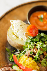 Dutch skewers with corn and cow steak, vegetables and sauce