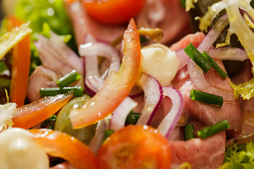 Fresh Vegetable Salad on black plate