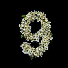 The number nine is made of delicate white flowers on a black background.
