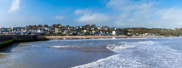 A view from the harbour towards the beach in the village of Saundersfoot, Wales on a bright spring...
