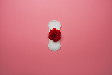 Hygienic pad with red carnation on pink