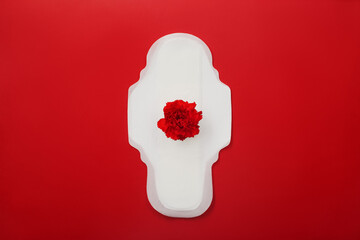Women's menstrual pad with carnations on red