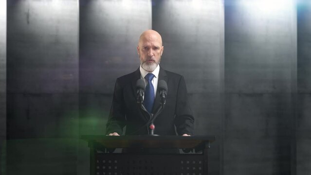 Male politician delivering speech at a podium on a dystopian future background. Political speech and diplomacy