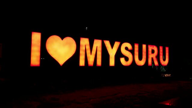 Mysuru, Karnataka, India-October 22 2023; A glowing Neon Light at the Maharaja memorial promoting tourism at Mysuru city during Dasara festival in Karnataka, India.
