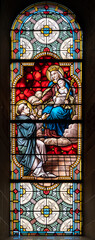 Saint Dominic receiving the rosary from the Virgin Mary. A stained-glass window in Église de la Sainte-Trinité (Holy Trinity Church) in Walferdange.