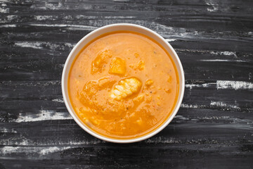 fish creme soup in big white bowl