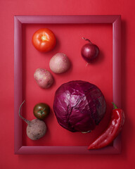Red vegetables in wooden picture frame