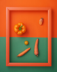Pepper, tomato and carrots on orange and green