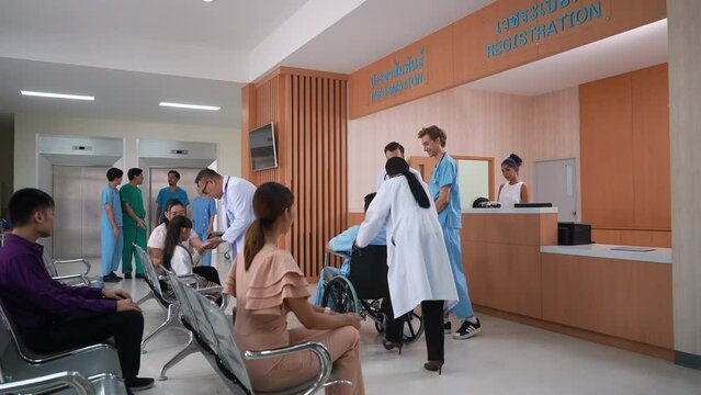 Medical staff and patients in a busy hospital reception services at information desk. many patients wait for health care specialists in a hospital waiting area. medical team doctors walking pass lobby