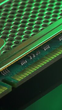 Kit of computer memory chip isolated on green light mirror background. PC upgrade or repair concept. Random Access Memory abbreviated as DDR SDRAM. Computer hardware, electronic concept
