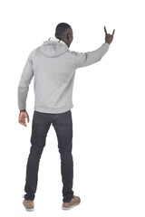 back view of a man showing the horns sign with fingers on white background - 786402752