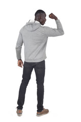 Fototapeta premium back view of a man showing her bicep on white background