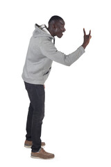 side view of a man showing the horns sign with fingers on white background - 786402791