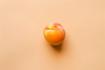 Nestled upon a soft, light orange canvas, a ripe, succulent peach exudes temptation, its glistening surface promising a burst of sweet, tangy flavor with each luscious bite