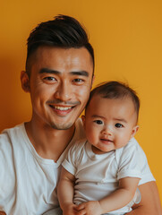 A beaming father of Asian descent non-specific to any country