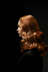 Naklejka premium Close-up photo of a woman's shiny healthy ginger or red hair isolated on a white background