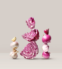Creative layout made of red cabbage, red onion and garlic on the beige background. Food concept. Macro concept.