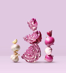 Creative layout made of red cabbage, red onion and garlic on the purple background. Food concept. Macro concept.