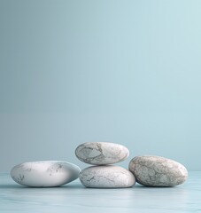 Marble rocks on light blue background