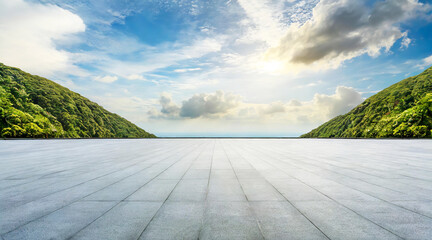 A vast, flat platform opens up to a scenic view of green, lush hills under a bright sky filled with fluffy clouds. The contrast between the man-made structure and the natural surroundings.AI generated