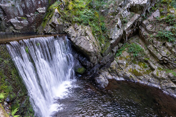 Obraz premium Passage channel and water cascade to Senhora da Piedade river beach in Serra da Lousã-Portugal.