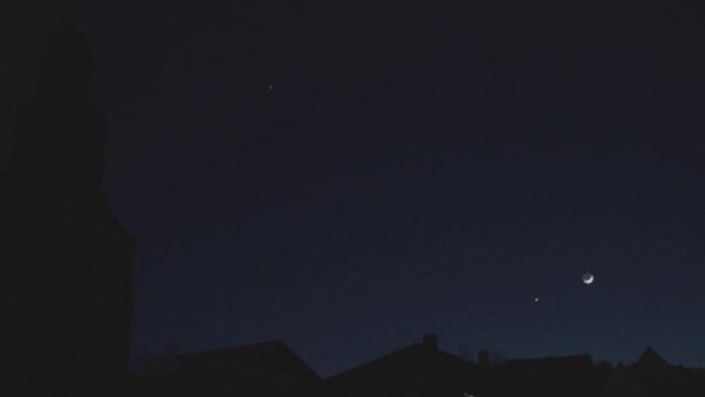 In the dark midnight sky, a few stars twinkle like gaspowered display devices, illuminating the electric blue horizon. A science font in the darkness, creating a mesmerizing circle event