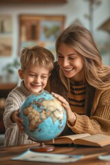 Fototapeta premium Boy and woman happily exploring a globe together