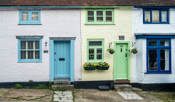 Colourfully painted doors and windows of English fisherman's cottages.
