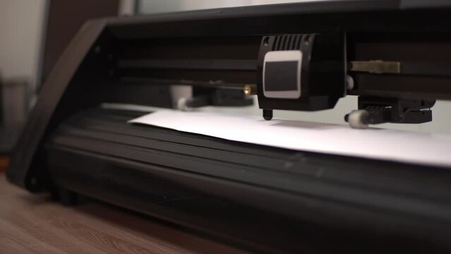 plotter cutting. self-adhesive film. flatbed plotter. High-quality shooting in 4K format.