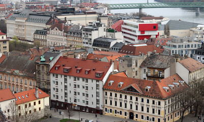 Fototapeta na wymiar View of Bratislava from the Old Town. Red roofed houses from above. Spring in Europe. 