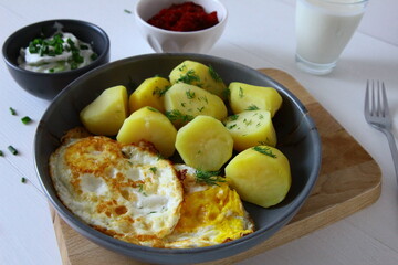 Potatoes with fried egg, buttermilk, beetroot and cucumber salad. Spring dinner - 786470947