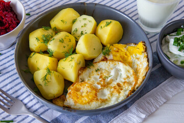 Potatoes with fried egg, buttermilk, beetroot and cucumber salad. Spring dinner - 786471969