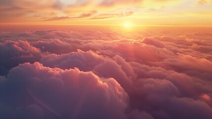 Natural background, Romantic sunset sky. Beautiful sunset sky above clouds with dramatic light. Cabin view from airplane