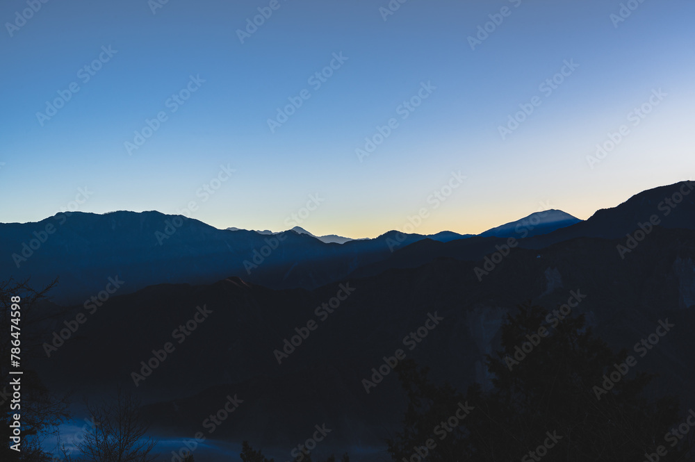 Wall mural Breathtaking sunrise vista from Alishan Mountain, Taiwan. The Alishan National Scenic Area is a mountain retreat and nature reserve situated in Alishan Township, Chiayi County, Taiwan.