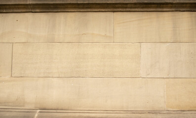 Close up of sandstone block wall on building