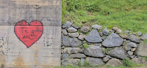 graffiti of a red heart on a wall