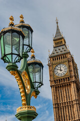 The Elizabeth Tower that hosts the bell Big Ben and one of the many ornate lanterns in the city of...