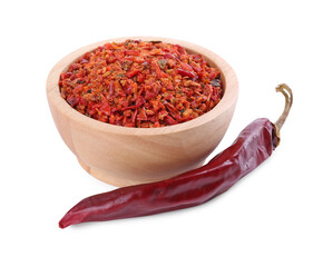 Aromatic spice. Red chili pepper flakes in bowl and pod isolated on white