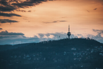 Sarajevo's captivating cityscape from above and the iconic TV tower rising tall against the sunset skyline. - 786485721