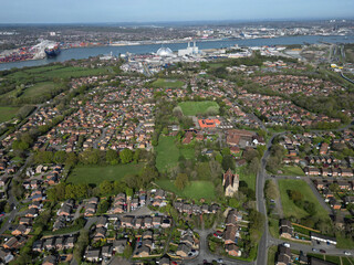 Panoramic view of Marchwood village aerial at high altitude. View towards busy industrial Southampton Docks and Marchwood Power station.
